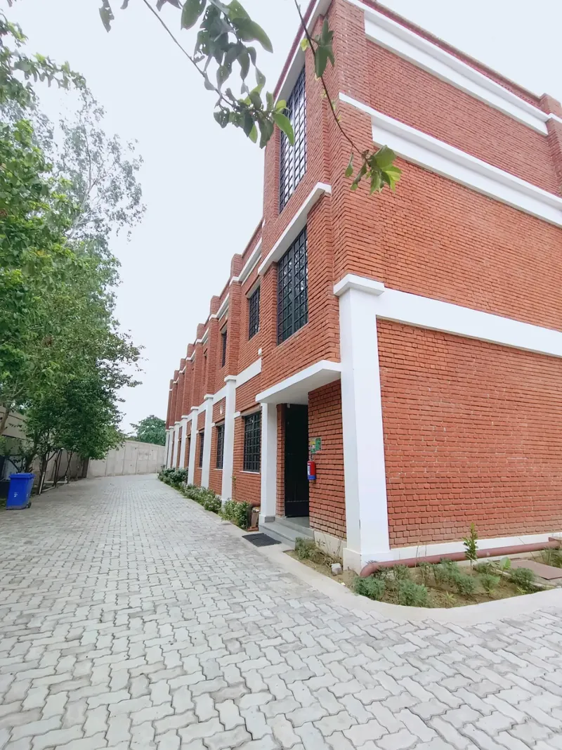 Farhan Exports factory building and paved courtyard in Unnao