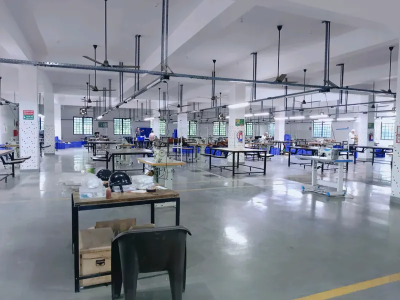 Workstations and marked walkways inside the Farhan Exports production facility